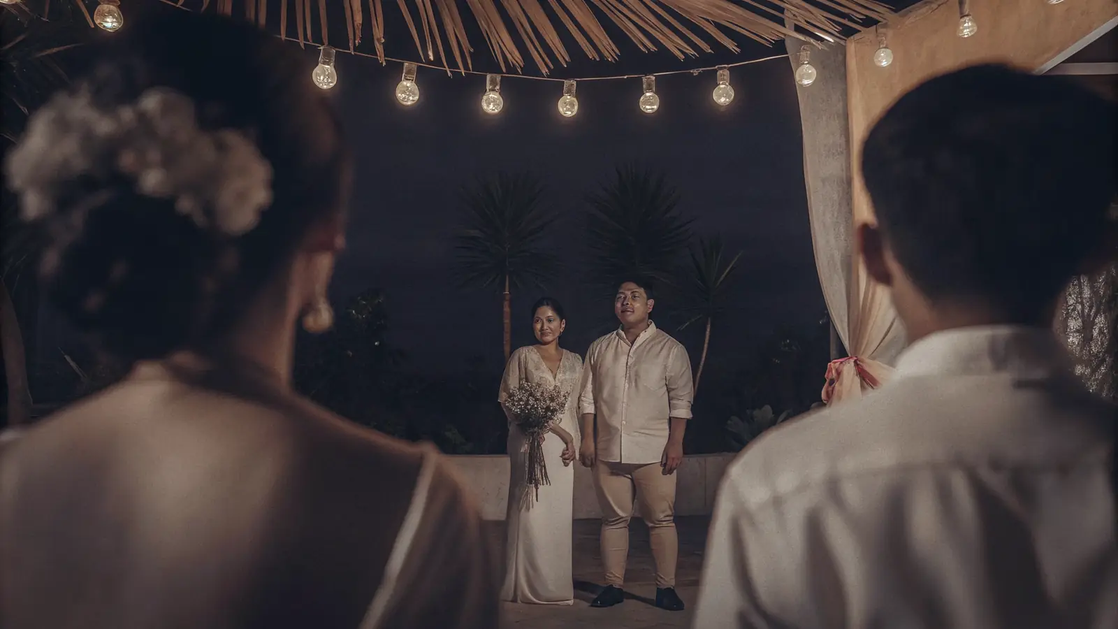 A Filipino wedding celebration with traditional touches — family, flowers and warm light