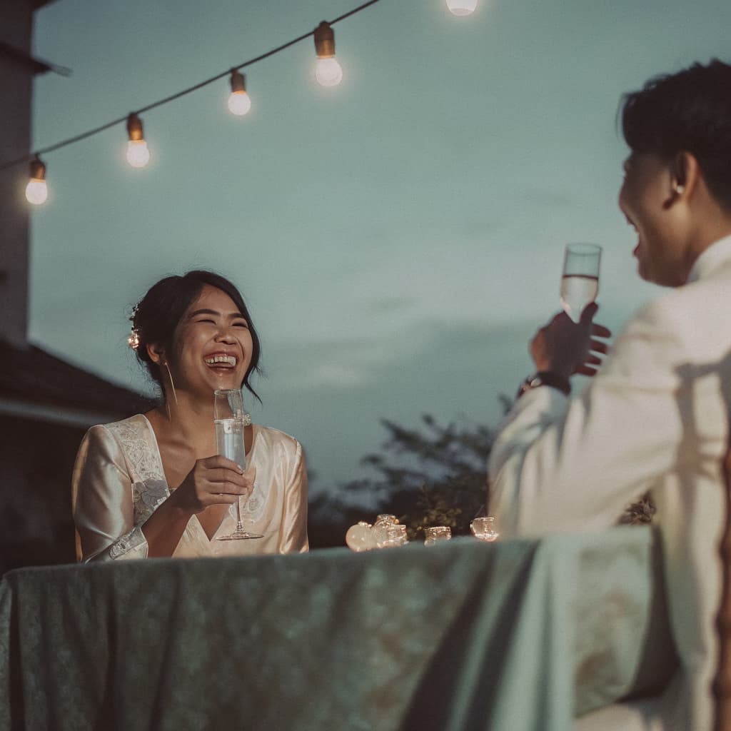 A toast at a Filipino reception, photographed from a guest’s own seat