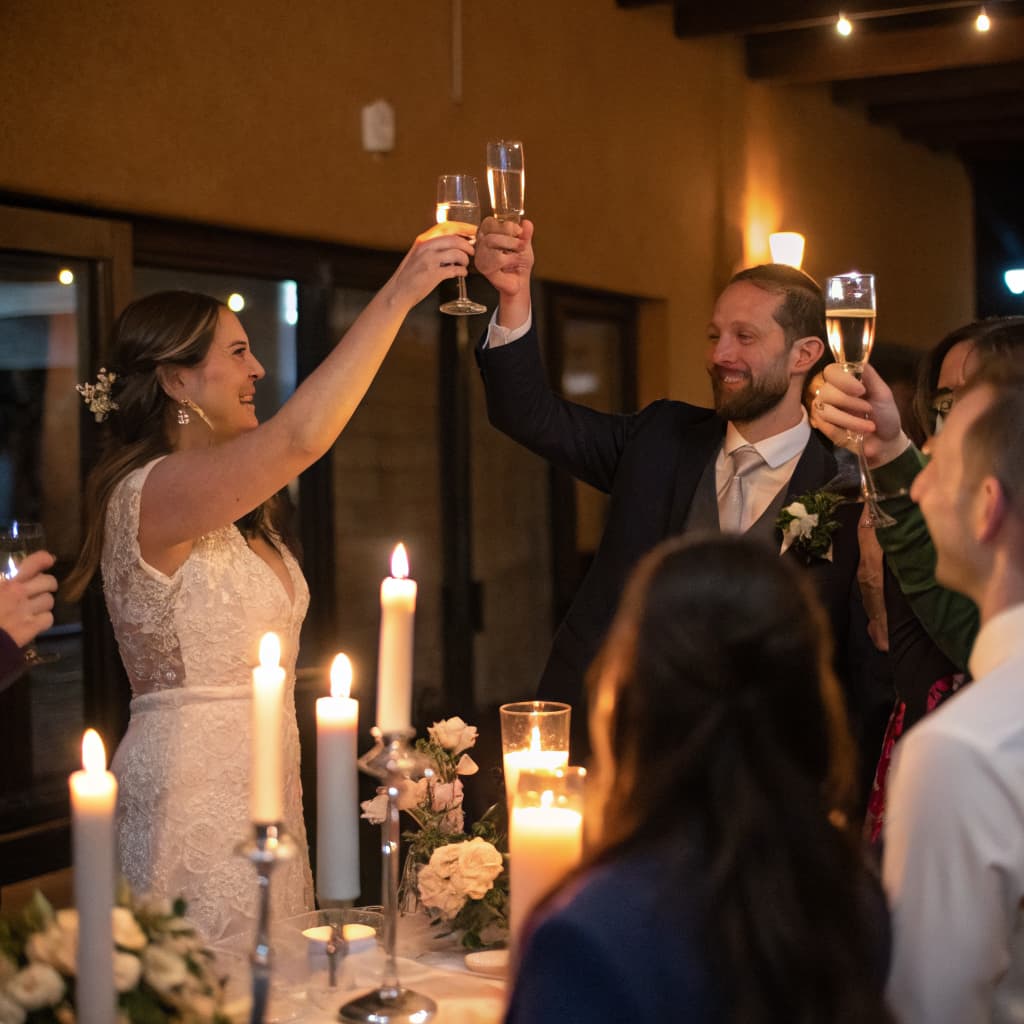 A toast, seen over the heads of the guests watching it